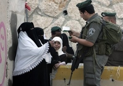 Israeli border guards check Palestinian women?s IDs as they head to Jerusalem at a checkpoint in Bethlehem, 2009.(AFP) Israeli border guards check Palestinian women?s IDs as they head to Jerusalem at a checkpoint in Bethlehem, 2009.(AFP)