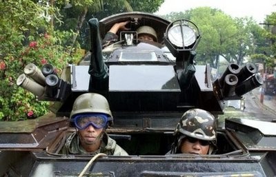 A Philippine armoured personnel carrier is pictured patrolling the streets in Isabela city, on the troubled southern Philippine island of Basilan. A Philippine armoured personnel carrier is pictured patrolling the streets in Isabela city, on the troubled southern Philippine island of Basilan.