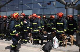 Chinese rescue workers with sniffer dogs line up at Xining airport before leaving for Yushu county in Qinghai province on April 15, 2010. AFP photo Chinese rescue workers with sniffer dogs line up at Xining airport before leaving for Yushu county in Qinghai province on April 15, 2010. AFP photo