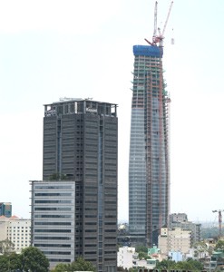 This photo, taken on April 15, 2010, shows the Bitexco Financial Tower with a shape of a lotus bud in Ho Chi Minh City’s District 1. The grey building seen next to it is Saigon Center. (Photo: Tuong Thuy) This photo, taken on April 15, 2010, shows the Bitexco Financial Tower with a shape of a lotus bud in Ho Chi Minh City’s District 1. The grey building seen next to it is Saigon Center. (Photo: Tuong Thuy)