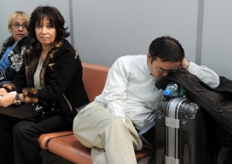 A man sleeps on April 17, 2010, as he wait for the resumption of air travel at the Marseille-Provence airport, in Marignan, southern France. Around 20 French airports have been closed since Thursday by the cloud of ash released from the volcanic eruption in Iceland. AFP PHOTO A man sleeps on April 17, 2010, as he wait for the resumption of air travel at the Marseille-Provence airport, in Marignan, southern France. Around 20 French airports have been closed since Thursday by the cloud of ash released from the volcanic eruption in Iceland. AFP PHOTO