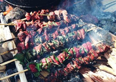 Buffalo meat is grilled over hot coals Buffalo meat is grilled over hot coals