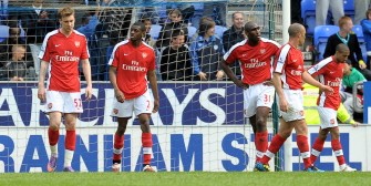 Arsenal players react after conceding a goal to Wigan Athletic during the English Premier league football match at the DW Stadium, Wigan, north-west, England, on April 18, 2010. AFP PHOTO Arsenal players react after conceding a goal to Wigan Athletic during the English Premier league football match at the DW Stadium, Wigan, north-west, England, on April 18, 2010. AFP PHOTO