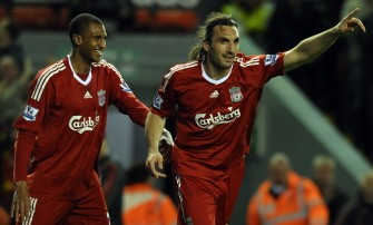 Liverpool's Greek defender Sotirios Kyrgiakos (R) celebrates with Liverpool's French forward David N'Gog after scoring against West Ham United during their English Premier League football match at Anfield in Liverpool, north-west England, on April 19, 2010. AFP PHOTO Liverpool's Greek defender Sotirios Kyrgiakos (R) celebrates with Liverpool's French forward David N'Gog after scoring against West Ham United during their English Premier League football match at Anfield in Liverpool, north-west England, on April 19, 2010. AFP PHOTO