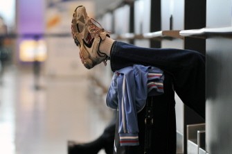 A passenger rests at the departure terminal of the Ataturk International airport in Istanbul on April 19, 2010. AFP photo A passenger rests at the departure terminal of the Ataturk International airport in Istanbul on April 19, 2010. AFP photo