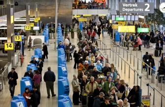 Passengers wait to complete check-in formalities at Schiphol Airport, near Amsterdam on April 20, 2010. AFP PHOTO Passengers wait to complete check-in formalities at Schiphol Airport, near Amsterdam on April 20, 2010. AFP PHOTO