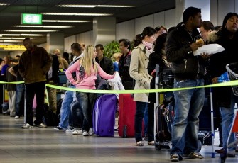 Passengers wait to complete check-in formalities at Schiphol Airport, near Amsterdam on April 20, 2010. AFP photo Passengers wait to complete check-in formalities at Schiphol Airport, near Amsterdam on April 20, 2010. AFP photo