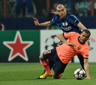 Barcelona's Brazilian defender Dani Alves (Bottom) fights for the ball with Inter Milan's Macedonian forward Goran Pandev during the UEFA Champions League first leg semifinal Inter Milan vs Barcelona football match on April 20, 2010 at San Siro stadium in Milan. Milan won 3-1. AFP PHOTO Barcelona's Brazilian defender Dani Alves (Bottom) fights for the ball with Inter Milan's Macedonian forward Goran Pandev during the UEFA Champions League first leg semifinal Inter Milan vs Barcelona football match on April 20, 2010 at San Siro stadium in Milan. Milan won 3-1. AFP PHOTO