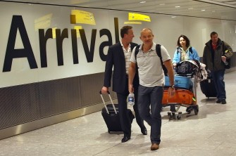 First passengers react as they arrive with first flight from Vancouver at London's Heathrow airport, as it was reopened on April 20, 2010 after a five-day airspace shutdown. AFP photo First passengers react as they arrive with first flight from Vancouver at London's Heathrow airport, as it was reopened on April 20, 2010 after a five-day airspace shutdown. AFP photo