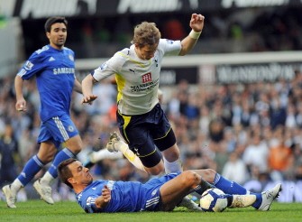 Chelsea defender John Terry tackles Tottenham striker Roman Pavlyuchenko (R) which leads to Terry receiving his first yellow card during the English Premier League football match between Tottenham Hotspur and Chelsea at White Hart Lane in London, England on April 17, 2010. AFP PHOTO Chelsea defender John Terry tackles Tottenham striker Roman Pavlyuchenko (R) which leads to Terry receiving his first yellow card during the English Premier League football match between Tottenham Hotspur and Chelsea at White Hart Lane in London, England on April 17, 2010. AFP PHOTO