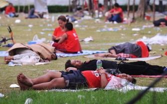 Anti-government "Red Shirt" protesters rest on the ground after an overnight rally at their camp in the central quarter of Silom in downtown Bangkok on April 24, 2010. AFP photo Anti-government "Red Shirt" protesters rest on the ground after an overnight rally at their camp in the central quarter of Silom in downtown Bangkok on April 24, 2010. AFP photo