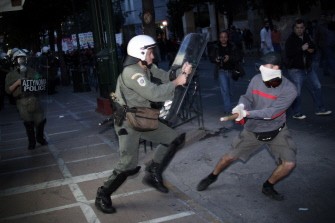 A policeman tries to arrest a demonstrator in central Athens on April 23, 2010. AFP photo A policeman tries to arrest a demonstrator in central Athens on April 23, 2010. AFP photo