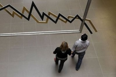 Employees walk in the Athens stock exchange. AFP photo Employees walk in the Athens stock exchange. AFP photo