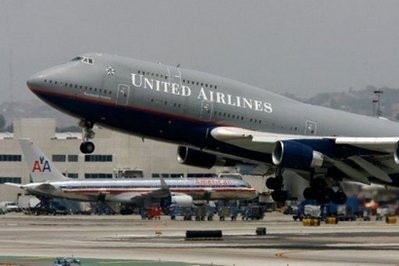 A United Airlines plane takes off from Los Angeles International Airport (LAX). United Airlines and Continental Airlines have announced a merger deal that will create the world's biggest carrier A United Airlines plane takes off from Los Angeles International Airport (LAX). United Airlines and Continental Airlines have announced a merger deal that will create the world's biggest carrier