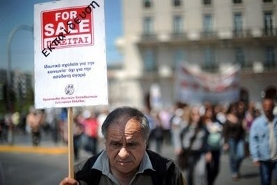 A teacher carries a banner reading: 'Education for sale' during a protest front of the Greek Parliament in Athens on May 4. AFP photo A teacher carries a banner reading: 'Education for sale' during a protest front of the Greek Parliament in Athens on May 4. AFP photo