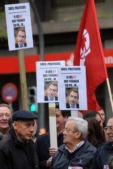 People hold flags and banners during a demonstration called by trade unions against austerity plans announced last month by the government of Prime Minister Jose Luis Rodriguez Zapatero. People hold flags and banners during a demonstration called by trade unions against austerity plans announced last month by the government of Prime Minister Jose Luis Rodriguez Zapatero.