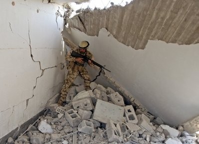 An Iraqi Army soldier inspects a destroyed house which was used by insurgents as a workshop to manufacture bombs, and was destroyed yesterday while they were preparing a bomb in Baghdad's Abu Ghraib suburb, Iraq, Thursday, May 6, 2010 An Iraqi Army soldier inspects a destroyed house which was used by insurgents as a workshop to manufacture bombs, and was destroyed yesterday while they were preparing a bomb in Baghdad's Abu Ghraib suburb, Iraq, Thursday, May 6, 2010