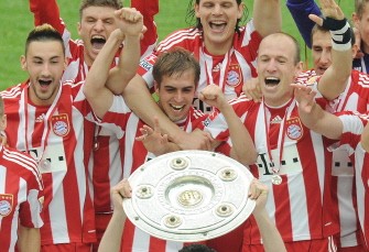 Bayern Munich celebrate with the Bundesliga trophy on May 8, 2010. AFP PHOTO Bayern Munich celebrate with the Bundesliga trophy on May 8, 2010. AFP PHOTO