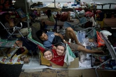 A Thai "Red Shirt" demonstrator sleeps inside a fortified camp in Bangkok. AFP photo A Thai "Red Shirt" demonstrator sleeps inside a fortified camp in Bangkok. AFP photo