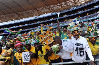 Excited Bafana Bafana fans over joyed to be at Soccer City in Soweto on May 22, 2010 wear makarapas during a local soccer game. AFP photo Excited Bafana Bafana fans over joyed to be at Soccer City in Soweto on May 22, 2010 wear makarapas during a local soccer game. AFP photo