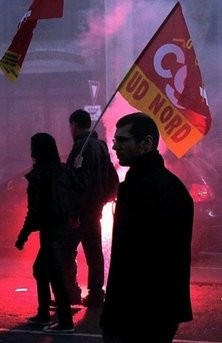 A person holds a banner of CGT trade-union during a demonstration in Lille, during a nationwide day of strike called by unions to protest against the pension overhaul. A person holds a banner of CGT trade-union during a demonstration in Lille, during a nationwide day of strike called by unions to protest against the pension overhaul.