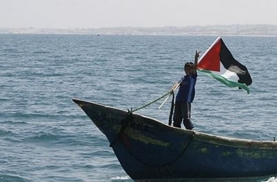 A Palestinian boy flashes the V-sign for victory as hundreds of Palestinians waited aboard fishing boats at the port of Gaza City to greet the so-called Freedom Flotilla. A Palestinian boy flashes the V-sign for victory as hundreds of Palestinians waited aboard fishing boats at the port of Gaza City to greet the so-called Freedom Flotilla.