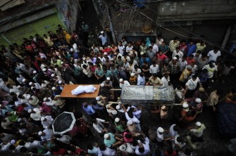 Residents and relatives carry the coffins of the previous day's Old Dhaka fire victims for burial in Dhaka on June 4, 2010. AFP photo Residents and relatives carry the coffins of the previous day's Old Dhaka fire victims for burial in Dhaka on June 4, 2010. AFP photo