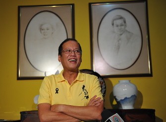 Incoming Philippine president Benigno Aquino smiles next to the portraits of his late parents, former president Corazon Aquino (L) and the senator Benigno Aquino Jnr (R), during a press conference at his residence in Manila on June 7, 2010. AFP photo Incoming Philippine president Benigno Aquino smiles next to the portraits of his late parents, former president Corazon Aquino (L) and the senator Benigno Aquino Jnr (R), during a press conference at his residence in Manila on June 7, 2010. AFP photo