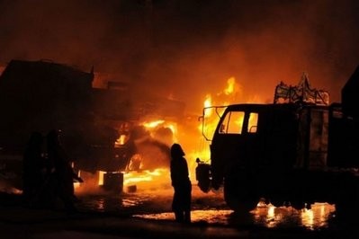 Pakistani fire fighters try to extinguish burning NATO supply trucks carrying military vehicles and oil following a militant attack on the outskirts of Islamabad on June 9, 2010 Pakistani fire fighters try to extinguish burning NATO supply trucks carrying military vehicles and oil following a militant attack on the outskirts of Islamabad on June 9, 2010