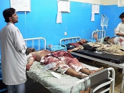 A doctor stands by the beds of people wounded after a huge explosion at wedding ceremony in Kandahar. AFP photo A doctor stands by the beds of people wounded after a huge explosion at wedding ceremony in Kandahar. AFP photo