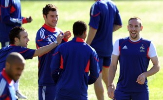 France's forward Franck Ribery (R) jokes with teammates during a training session at the Fields of Dreams stadium in Knysna on June 10. AFP photo France's forward Franck Ribery (R) jokes with teammates during a training session at the Fields of Dreams stadium in Knysna on June 10. AFP photo
