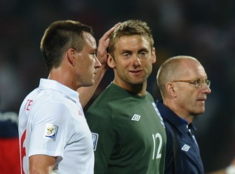 England's defender John Terry (L) comforts goalkeeper Robert Green at the end of their 2010 World Cup group C first round football match against the USA on June 12, 2010 at Royal Bafokeng stadium in Rustenburg. England's defender John Terry (L) comforts goalkeeper Robert Green at the end of their 2010 World Cup group C first round football match against the USA on June 12, 2010 at Royal Bafokeng stadium in Rustenburg.