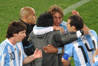 Argentina's coach Diego Maradona celebrates with Argentina's striker Lionel Messi (10) and Argentina's midfielder Javier Mascherano (14) during Group B first round 2010 World Cup football match on June 12, 2010 at Ellis Park stadium in Johannesburg. Argentina's coach Diego Maradona celebrates with Argentina's striker Lionel Messi (10) and Argentina's midfielder Javier Mascherano (14) during Group B first round 2010 World Cup football match on June 12, 2010 at Ellis Park stadium in Johannesburg.