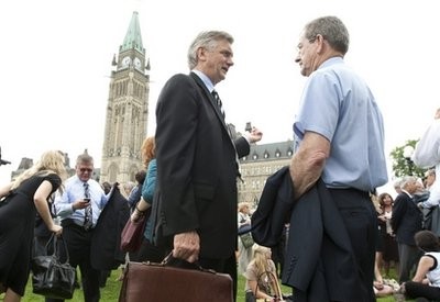 Senators, parliamentarians and their staff are shown after being evacuated from Parliament Buildings following an earthquake in Ottawa, Canada on Wednesday June 23, 2010. Senators, parliamentarians and their staff are shown after being evacuated from Parliament Buildings following an earthquake in Ottawa, Canada on Wednesday June 23, 2010.