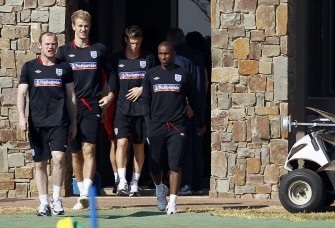 England's striker Wayne Rooney (L), goalkeeper Joe Hart, midfielder James Milner and striker Jermain Defoe (R) leave their residence before a training session at the Royal Bafokeng Sports Campus near Rustenburg on June 24, 2010. AFP England's striker Wayne Rooney (L), goalkeeper Joe Hart, midfielder James Milner and striker Jermain Defoe (R) leave their residence before a training session at the Royal Bafokeng Sports Campus near Rustenburg on June 24, 2010. AFP