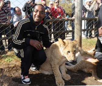 Cacau pets a young lion at the "Lion Park" reserve in Lanseria, South Africa, on June 25, 2010. AFP Cacau pets a young lion at the "Lion Park" reserve in Lanseria, South Africa, on June 25, 2010. AFP