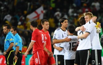 Germany's national football team players celebrate next to England players after winning the match Germany vs. England on June 27, 2010. AFP Germany's national football team players celebrate next to England players after winning the match Germany vs. England on June 27, 2010. AFP