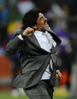 Argentina's coach Diego Maradona celebrates the team's third goal during the match Argentina vs. Mexico on June 27, 2010. AFP Argentina's coach Diego Maradona celebrates the team's third goal during the match Argentina vs. Mexico on June 27, 2010. AFP