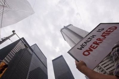 A protestor holds a sign during a demonstration in Toronto's the financial district on June 27, 2010. AFP A protestor holds a sign during a demonstration in Toronto's the financial district on June 27, 2010. AFP