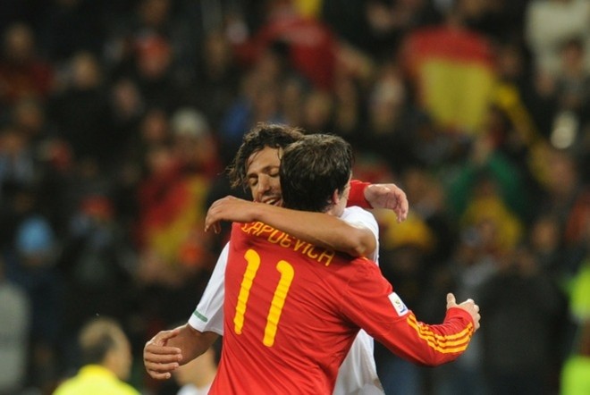Spain's defender Joan Capdevila (L) celebrates with Portugal's defender Bruno Alves after the match Spain vs. Portugal on June 29, 2010. AFP Spain's defender Joan Capdevila (L) celebrates with Portugal's defender Bruno Alves after the match Spain vs. Portugal on June 29, 2010. AFP