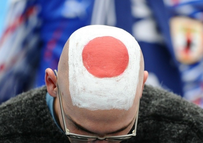 A man shows his shaved head painted as the Japanese national flag before the match Paraguay versus Japan on June 29, 2010. AFP A man shows his shaved head painted as the Japanese national flag before the match Paraguay versus Japan on June 29, 2010. AFP