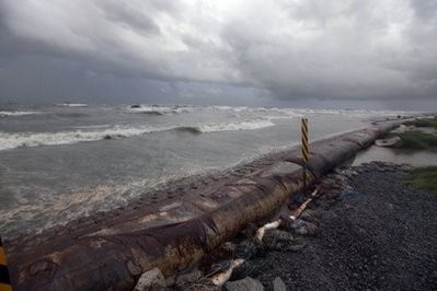 Clouds and heavy waves are seen off an oil stained beach after oil cleanup workers were evacuated in the area around Fourchon Beach in Port Fourchon, Louisiana. Clouds and heavy waves are seen off an oil stained beach after oil cleanup workers were evacuated in the area around Fourchon Beach in Port Fourchon, Louisiana.