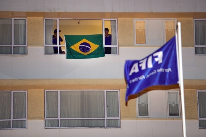 Staff member of the Brazil's team install a national flag in a window of the Protea Marine Hotel upon the arrival of the squad on late June 30, 2010 in Port Elizabeth. AFP Staff member of the Brazil's team install a national flag in a window of the Protea Marine Hotel upon the arrival of the squad on late June 30, 2010 in Port Elizabeth. AFP