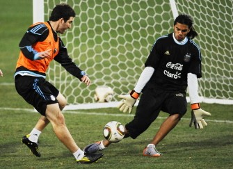 Argentina's forward Gonzalo Higuain (L) shoots to the goal in front of goalkeeper Sergio Romero during a training session at the University's High Performance Centre in Pretoria on June 30, 2010. AFP Argentina's forward Gonzalo Higuain (L) shoots to the goal in front of goalkeeper Sergio Romero during a training session at the University's High Performance Centre in Pretoria on June 30, 2010. AFP