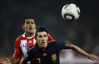 Spain's striker David Villa (front) and Paraguay's defender Paulo da Silva eye the ball during the quarter-final match Paraguay vs. Spain on July 3, 2010. AFP Spain's striker David Villa (front) and Paraguay's defender Paulo da Silva eye the ball during the quarter-final match Paraguay vs. Spain on July 3, 2010. AFP