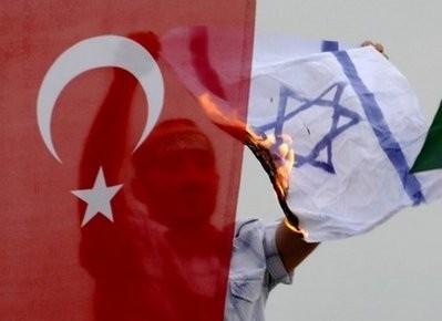 A Turkish demonstrator burns an Israeli flag during a protest in Istanbul A Turkish demonstrator burns an Israeli flag during a protest in Istanbul