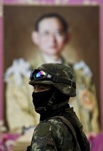AFP/File – A Thai soldier stands guard in front of a portrait of Thai King Bhumibol Adulyadej in central Bangkok AFP/File – A Thai soldier stands guard in front of a portrait of Thai King Bhumibol Adulyadej in central Bangkok