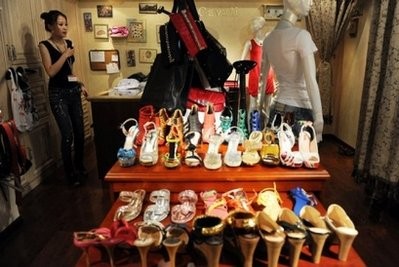 Shoes and other goods are seen displayed at a departmental strore in Beijing Shoes and other goods are seen displayed at a departmental strore in Beijing