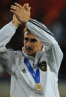 Germany's striker Miroslav Klose applauds after the medal ceremony of the 2010 World Cup third place football match Uruguay vs. Germany on July 10, 2010 in Port Elizabeth. Germany defeated Uruguay 3-2 to take the third place. AFP Germany's striker Miroslav Klose applauds after the medal ceremony of the 2010 World Cup third place football match Uruguay vs. Germany on July 10, 2010 in Port Elizabeth. Germany defeated Uruguay 3-2 to take the third place. AFP
