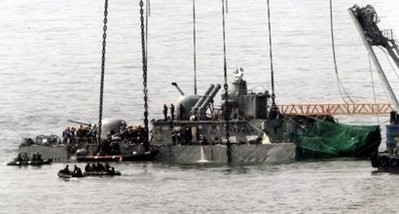A giant floating crane lifts the stern of the South Korean warship Cheonan to place it on a barge in April 2010. (AFP file) A giant floating crane lifts the stern of the South Korean warship Cheonan to place it on a barge in April 2010. (AFP file)